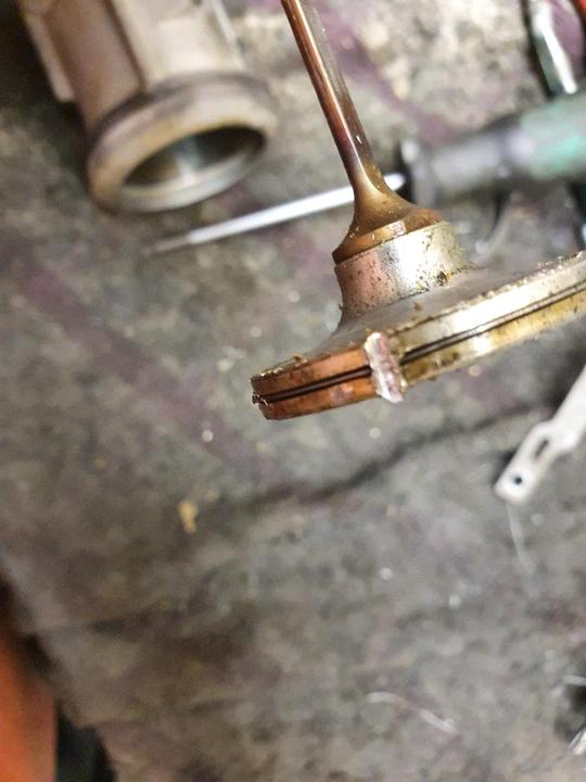 Damaged piston from a nail inside a Paslode IM65